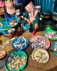 Selective focus. Traditional market traders selling fresh fish from the river and sea. Sell fish. Traditional markets. Kendal, Indonesia.
