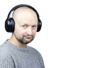 In Tune with Style: A Man in a Grey Wool Sweater and Headphones