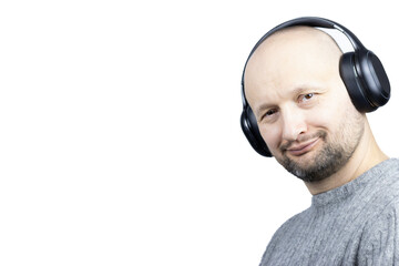 This is a captivating portrait of a man, set against a stark white background. He is clad in a finely knit grey wool sweater, his face expressing joy and contentment