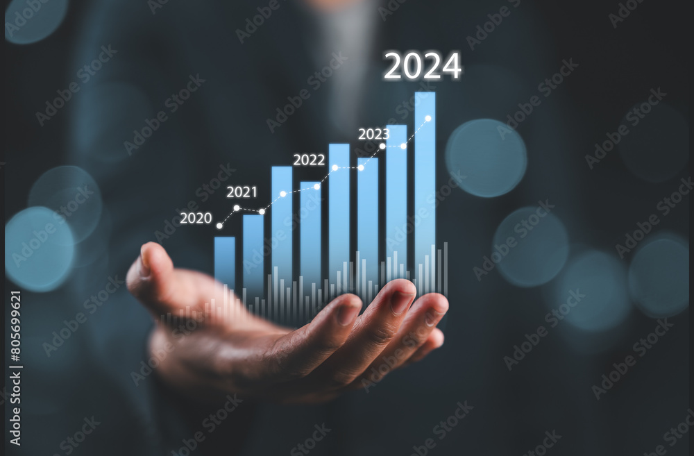 Poster businessman holding glowing virtual technical graph and chart for analysis stock market in 2024, tec
