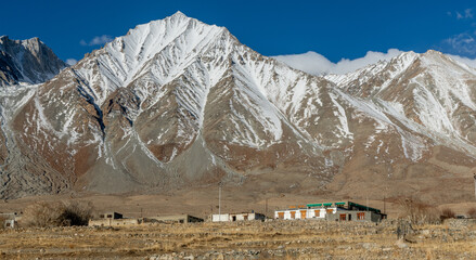 Kangju Kangri, at 22,064 feet, and mountains in the Karakoram Range near Pangong Lake along the...