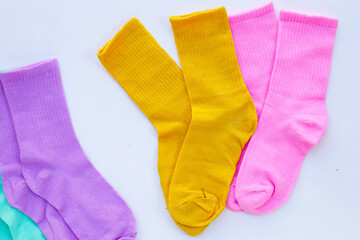 Colorful socks on white background.