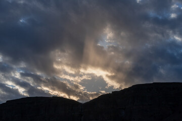Dramatic Sun Rays and Eveing Clouds Mt Silhouette