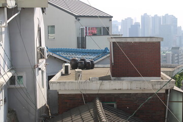 Traditional Korean ceramic fermentation jars in rooftop terrace