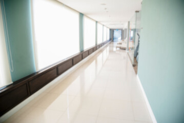 Blurred background hospital healthcare white bokeh with copy space. Blue clean bright blurry background medical laboratory backdrop. Interior lobby simple living space light bokeh. Blurry hallway