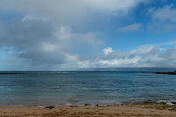 Beautiful rainbow over Molokai island viewed from the Kapalua Bay Beach on Maui, Hawaii 