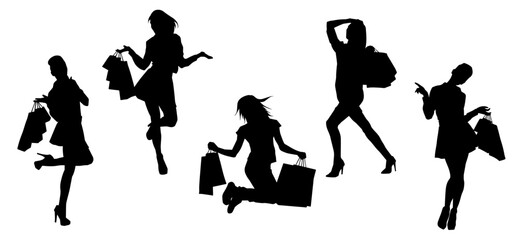 Silhouette of  slim young woman carrying shopping bags.