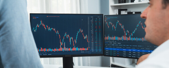 Stock exchange traders discussing digital currency on panorama view in market online focusing on...