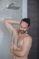 Handsome man mustache beard outdoor shower. cleaning the body Cleanse dirt on body.
