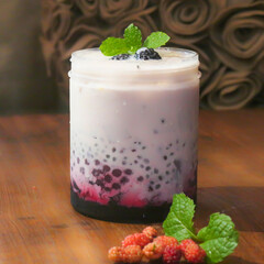 Creamy Mulberry Sago Dessert, is a sweet dessert from Hong Kong. Made by puree mulberry, sago pearl, and evaporated milk with mint leaves and mulberries topping.