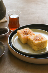 Turkish semolina cake served with Turkish chai tea