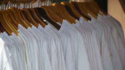White shirts lined up in a clothing store