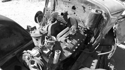 Black and White Engine Compartment of Old Vehicle Rusting in California Desert
