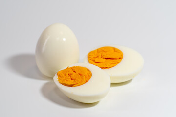 Piece of boiled egg. Isolated over white