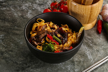 Asian wok with noodle, vegetables and beef