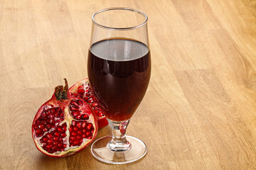 Sweet pomegranate juice in glass