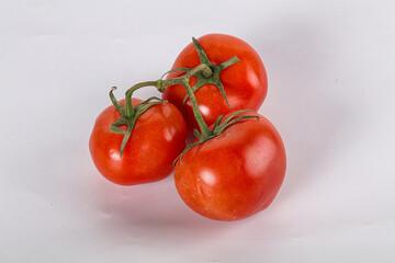 Sweet ripe tomatoes on the branch