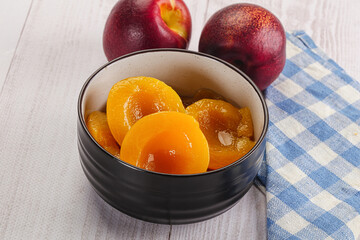 Canned peaches with sweet syrope