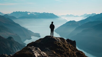 A person looking out over a mountain vista, metaphor for overcoming mental health challenge