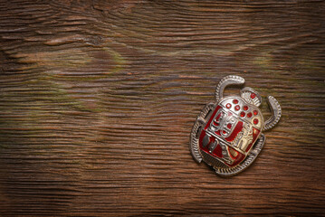Scarab beetle with ancient Egypt hieroglyph close up concept background with copy space.
