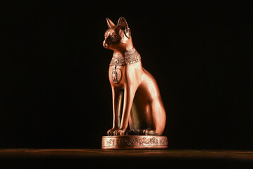 Ancient Egypt goddess Bast (Bastet) silluethe in the lights close up.