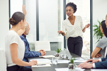 Businesswoman, leadership and presentation in office for meeting, teamwork and diversity. Black female person, marketing manager and collaboration for brainstorming in workplace with corporate people