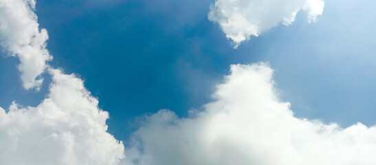 The wide view of the blue sky and thick white clouds is enchanting