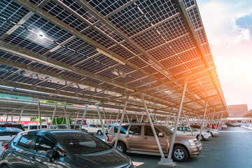 Solar panels installed over parking lot with parked cars for effective generation of clean energy...
