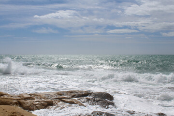 beach and sea,natural background texture sky, sea and stone, Mediterranean coast in Spain, waves on the sea, 