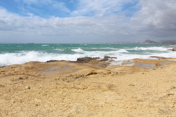 beach and sea,natural background texture sky, sea and stone, Mediterranean coast in Spain, waves on the sea, 