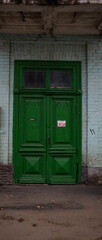 An old wooden door of an apartment building.