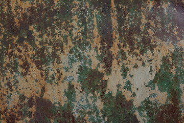 The texture of the metal surface with rust and paint residues.