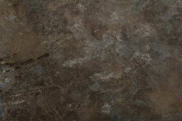 The texture of the surface with signs of wear and scratches.
