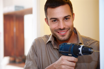Portrait, DIY and drill for maintenance, handyman and home improvement for wall or house. Manual labour, tools and smile with equipment, renovation and household construction for contractor repair
