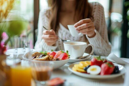 Woman savoring a nutritious breakfast in a charming restaurant on a delightful morning