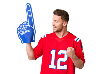 Young caucasian sports fan man over isolated chroma key background celebrating a victory