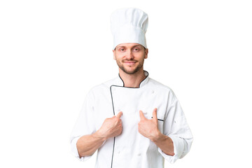 Young caucasian chef over isolated chroma key background with surprise facial expression