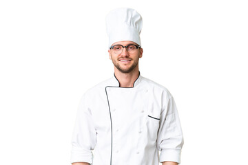 Young caucasian chef over isolated chroma key background with glasses and happy