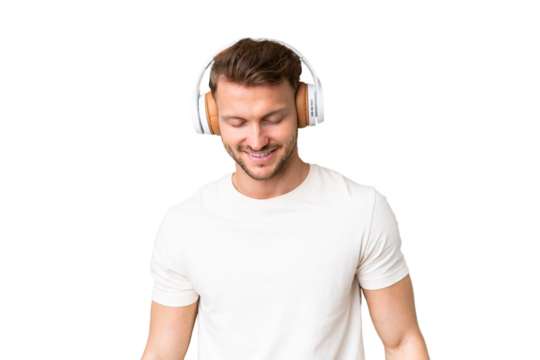 Young handsome caucasian man over isolated chroma key background listening music