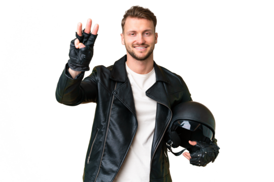 Young caucasian man with a motorcycle helmet over isolated chroma key background happy and counting three with fingers