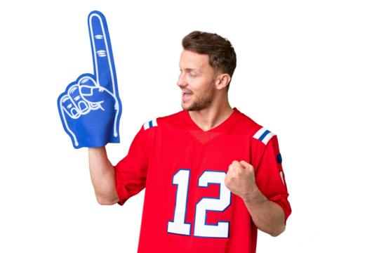 Young caucasian sports fan man over isolated chroma key background celebrating a victory