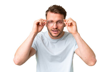 Young handsome caucasian man over isolated chroma key background With glasses and frustrated expression