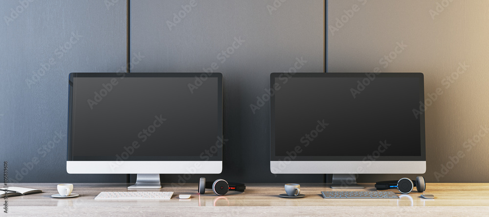 Poster Two empty gaming computer displays on table with coffee cups and headsets. Place for your advertisement. Gaming club concept. Mock up, 3D Rendering.
