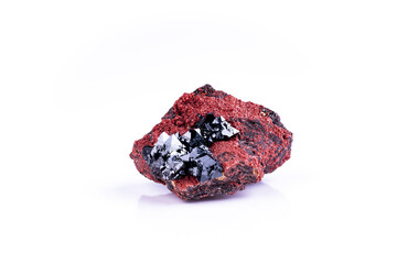 Black Hausmannite on red andradite, photography isolated on white blackground. From NChwaning II Mine, Kuruman, Kalahari, Northern Cape Province, South Africa