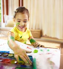 Finger painting, creative and girl kid with homework, assignment or project for school at home....