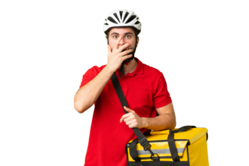 Young delivery man with thermal backpack over isolated chroma key background surprised and shocked while looking right