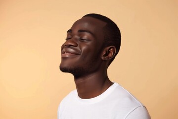 Obraz premium Joyful African American Man Smiling on Beige Background