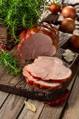 Smoked pork ham on a wooden table.