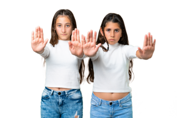 Friends girls holding gift and a birthday cake over isolated chroma key background making stop gesture for disappointed with an opinion