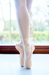 Girl, legs and ballet pointe in studio, dancer and practice technique for balance in performance....